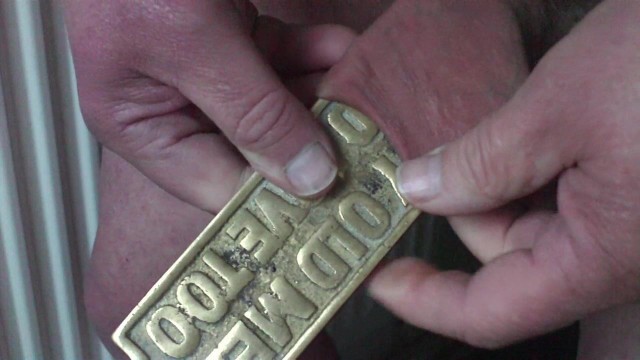 Brass plaque in foreskin