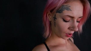Girl with a tattoo on her face, playing with her pussy