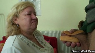 Busty granny tastes yummy cock